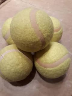 Five tennis balls new,