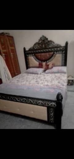 metal bed with mattress.