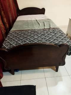 2 single wooden bed