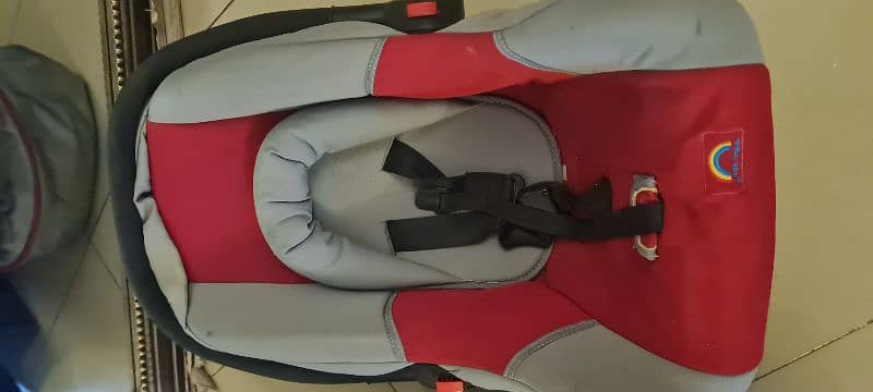 carry cot/ car seat both are in good condition each price 6000Rs 2