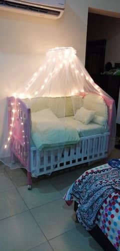 baby cot for sale along with bed set.