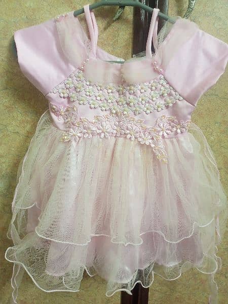 baby girl fancy frock in baby pink colour 0