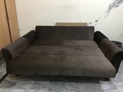Two piece  Sofa cum  Bed in Brown colour.