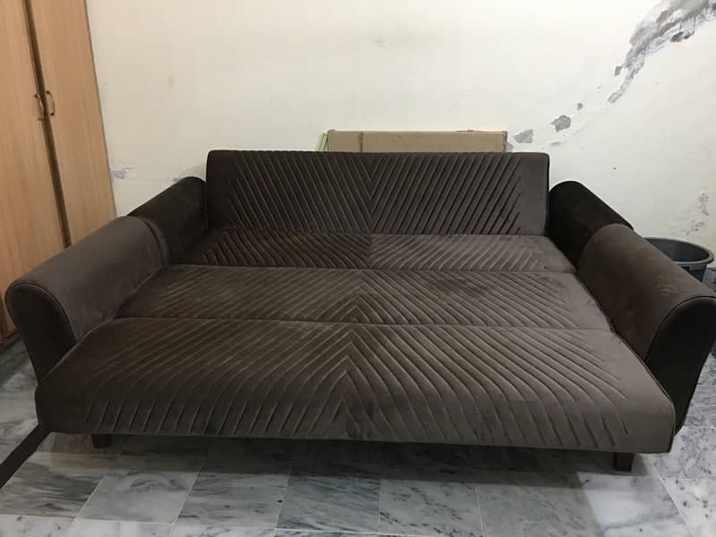 Two piece  Sofa cum  Bed in Brown colour. 0
