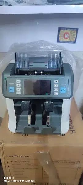 cash counting Machine, mix note counting with fake detection Pakistan 1