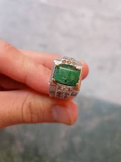 Ring of Emerald and diamonds on both sides. 60 cents diamonds in ring.