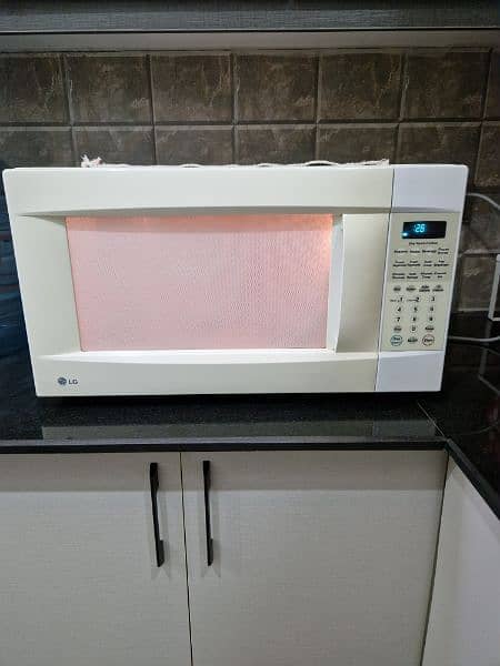 LG full size 60 litres microwave oven in mint condition . 10
