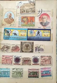 vintage post stamp collection book with various Pakistani stamps