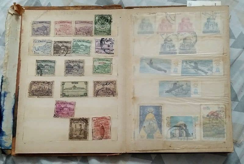 vintage post stamp collection book with various Pakistani stamps 1
