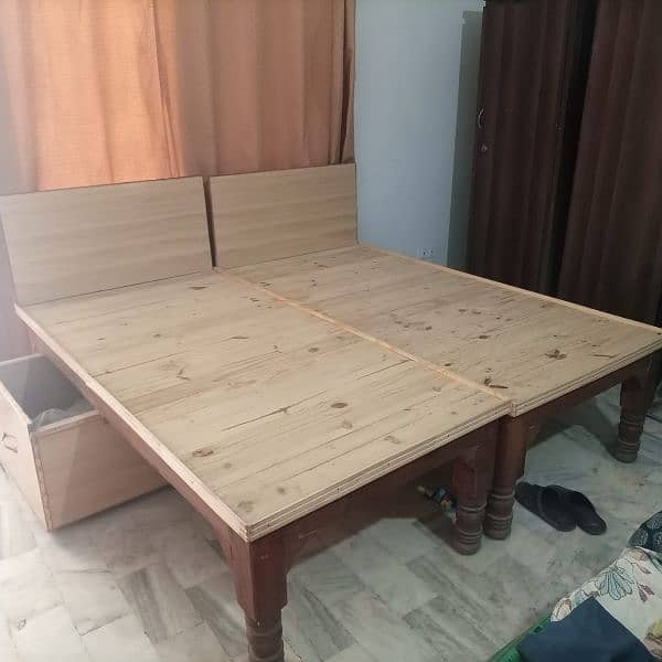 Selling 2 Chokies bed with two big size storge space without mattress. 2