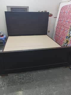 wooden brown bed