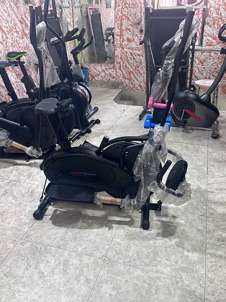 Walking machine +Eliptical cycle and apin bike dumbles 9