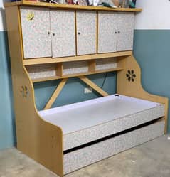 Double story sliding bed with cabinets