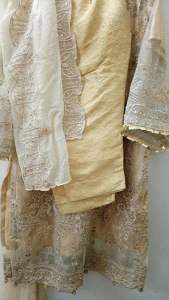 heavily embroided golden dress 4