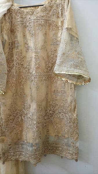 heavily embroided golden dress 10