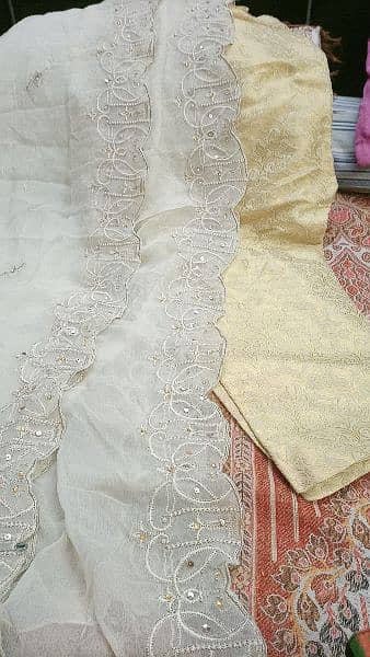 heavily embroided golden dress 12