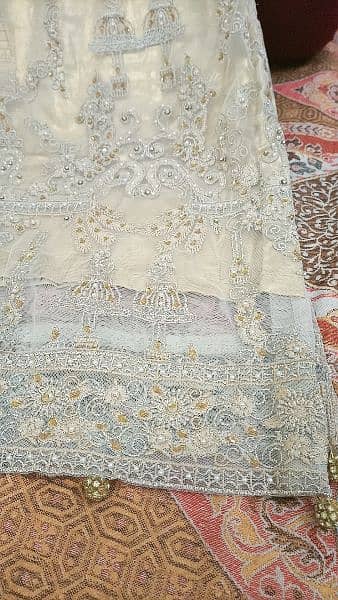 heavily embroided golden dress 14