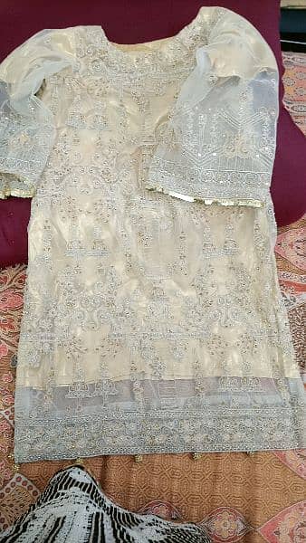 heavily embroided golden dress 16