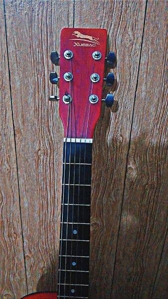 great guitar with wooden color and strong strings 2