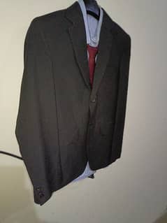 black pent coat with shirt and tie