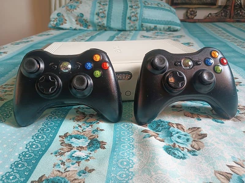 Xbox 360 with Original charger and original two wireless controller 2