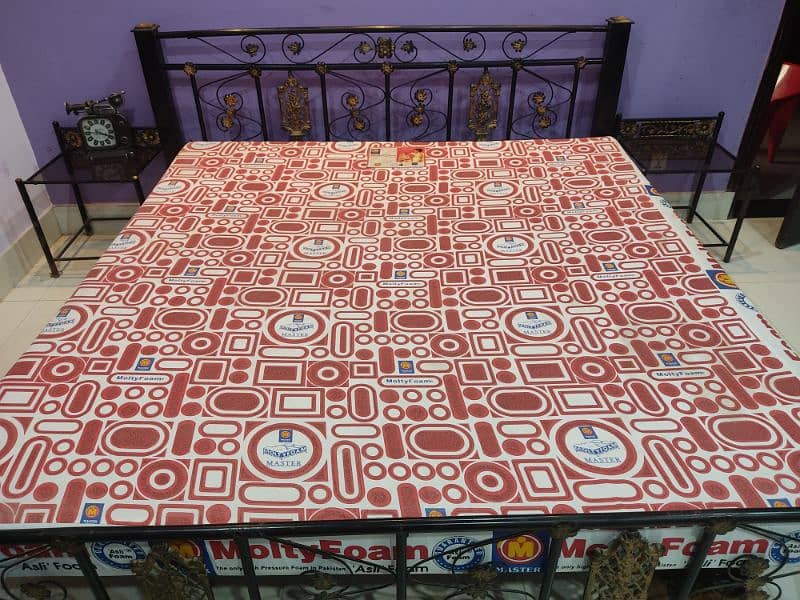 King size iron bed with a molty foam mattress and 2 side tables Beds