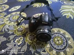 Nikon d3100 DSLR with 35-70mm lens 10/9 condition price negotiable