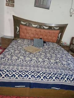 bed with two side tables and matress