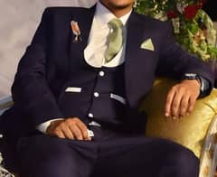 stylish , three piece suit for groom
