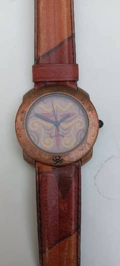 Benetton by Bulova Swiss 
Made Quartz watch