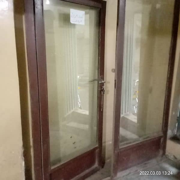 Glass door with iron frame for shop clinic saloon or office. 1