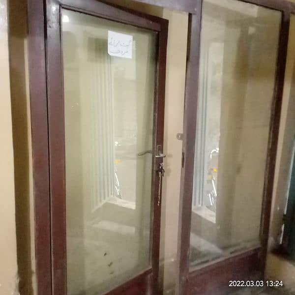 Glass door with iron frame for shop clinic saloon or office. 2