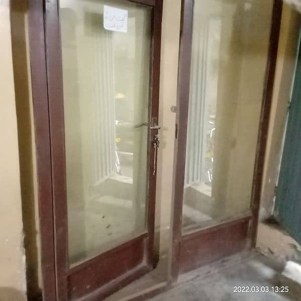 Glass door with iron frame for shop clinic saloon or office. 5
