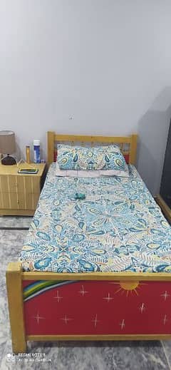 single bed with side table and mattress