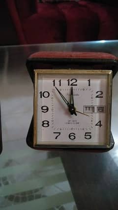old antique portable clock made in usa and Japan