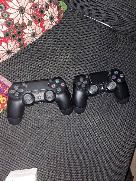 PS4 standard for sale with controllers and games 1