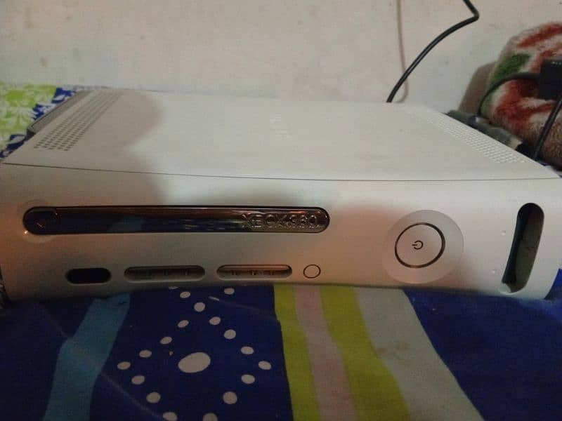 Xbox 360 with two wireless controllers 0