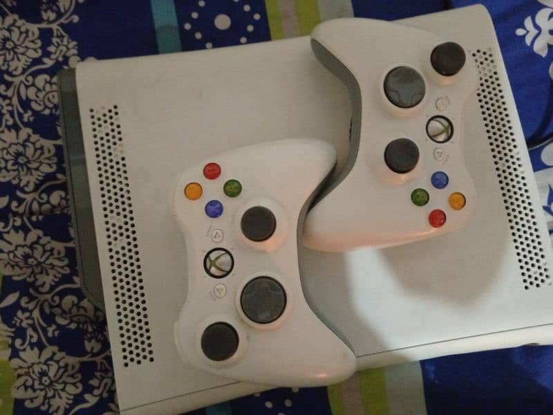 Xbox 360 with two wireless controllers 1