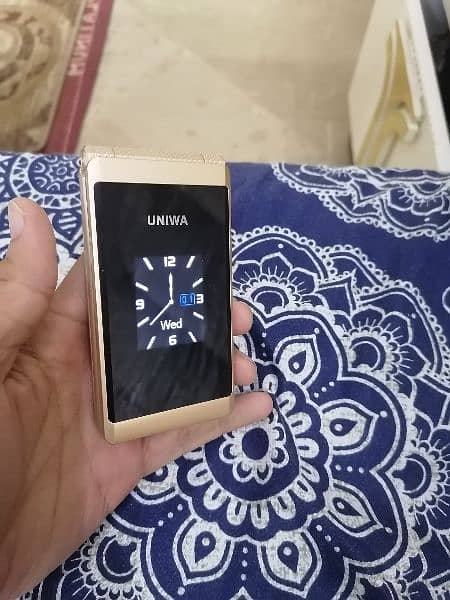 uniwa flip flap folding dual screen, dual sim mobile 8