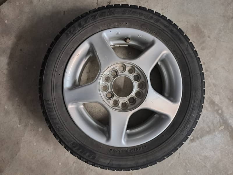 Japanese only 1 Original Alloy Wheel and 2 Tyres. 0