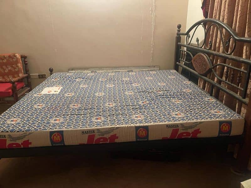 used rodiron king-sized bed with mattress 2