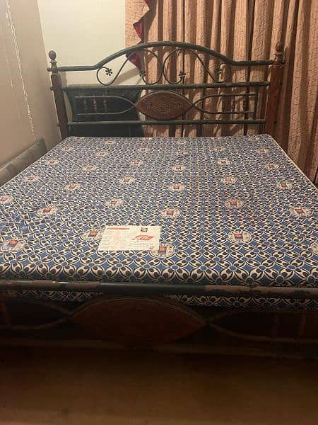 used rodiron king-sized bed with mattress 6