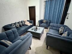 7 seater sofa with central table available for sale.