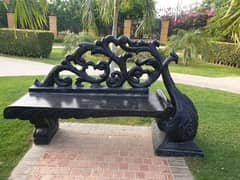 Cemented peacock Garden bench