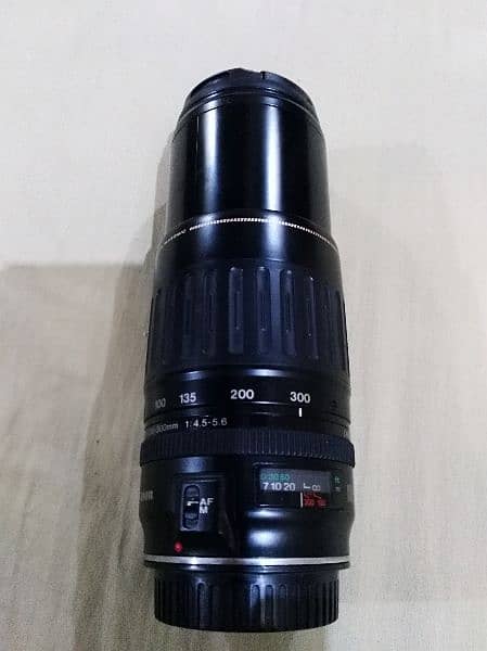 Canon lens 100 300 with caps 0