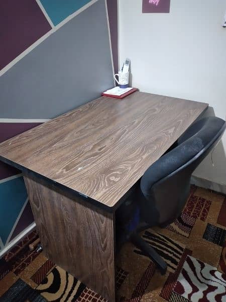 Wooden table with 3 drawers and revolving chair 1