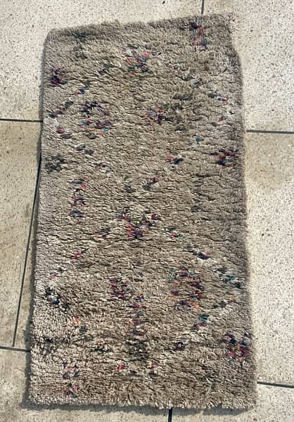 A Beautiful Small Beige Carpet 0