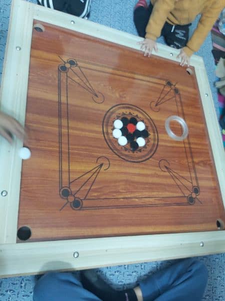 New carrom board with all carrom coins and striker 1