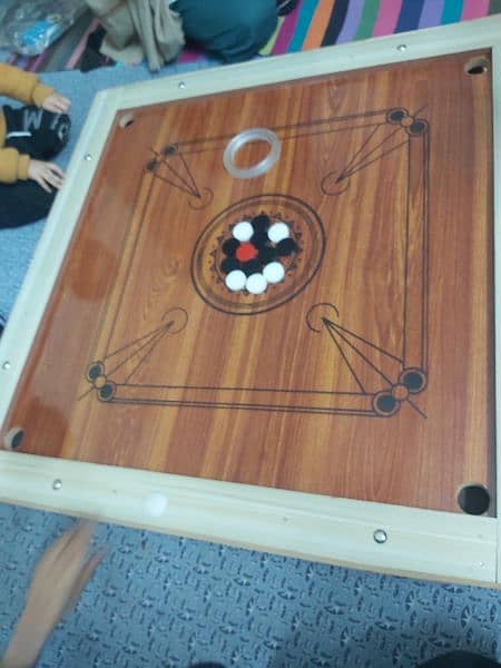 New carrom board with all carrom coins and striker 2