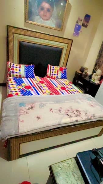 Bed with side tables and a dressing and a bed bench. 1
